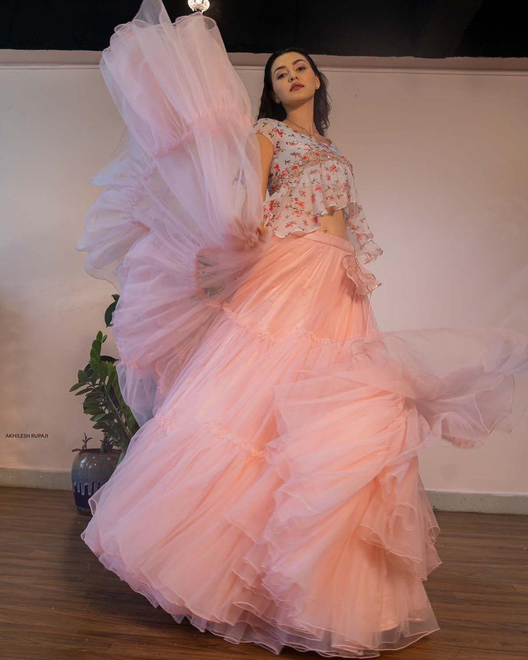 Angel on earth in our pink flared layers lehenga and floral peplum top.